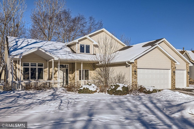 view of front of home with covered porch and an attached garage