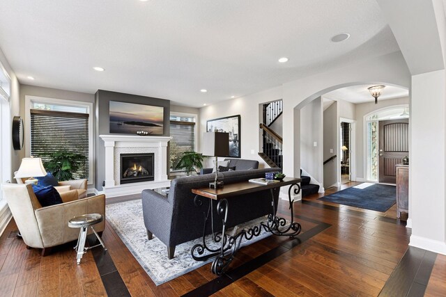 221 George St, Excelsior, MN 55331 - living room with wood-type flooring, arched walkways, stairs, plenty of natural light, and recessed lighting