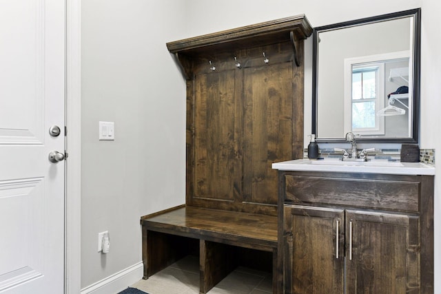 221 George St, Excelsior, MN 55331 - mudroom featuring baseboards, a sink, and tile patterned flooring