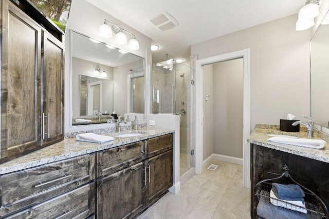 221 George St, Excelsior, MN 55331 - full bathroom with a shower stall, two vanities, marble finish floors, and baseboards