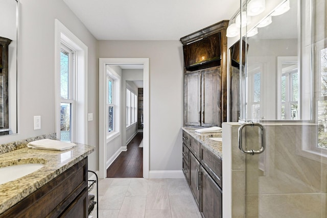 221 George St, Excelsior, MN 55331 - full bath with two vanities, a stall shower, and baseboards