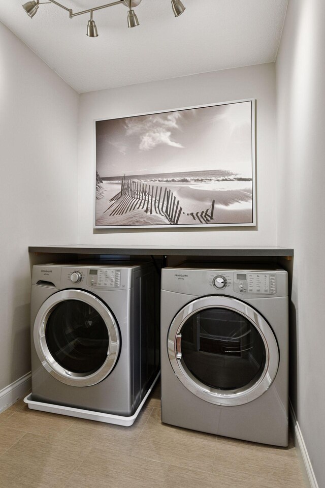 221 George St, Excelsior, MN 55331 - laundry room with washer and dryer and baseboards