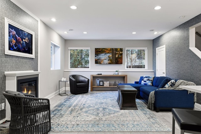 221 George St, Excelsior, MN 55331 - living room featuring recessed lighting, a glass covered fireplace, baseboards, and wood finished floors