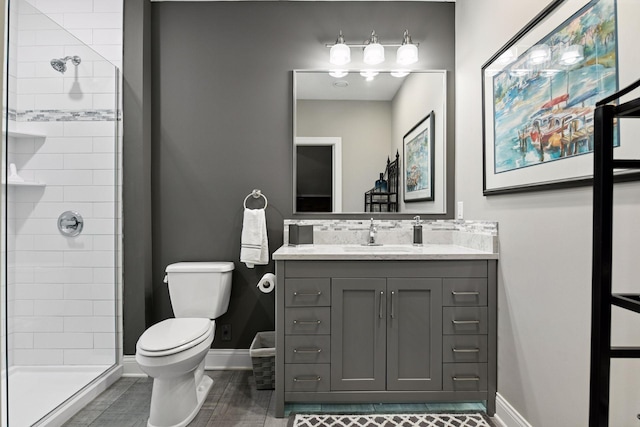 221 George St, Excelsior, MN 55331 - full bath with toilet, vanity, a stall shower, and baseboards