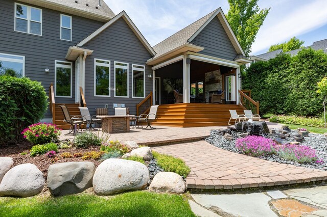 221 George St, Excelsior, MN 55331 - rear view of house with a patio area and roof with shingles
