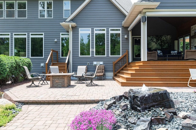 221 George St, Excelsior, MN 55331 - back of property featuring a fire pit and a patio area