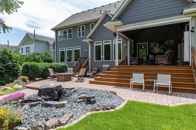 221 George St, Excelsior, MN 55331 - back of property featuring a patio and a fire pit