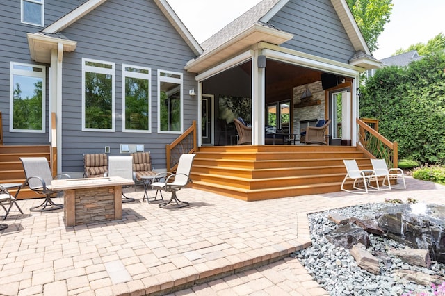 221 George St, Excelsior, MN 55331 - view of patio / terrace featuring an outdoor fire pit