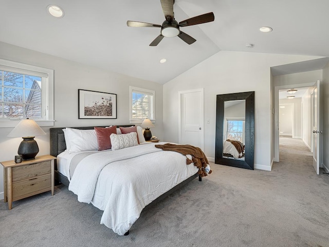 bedroom featuring light carpet, baseboards, a ceiling fan, vaulted ceiling, and recessed lighting