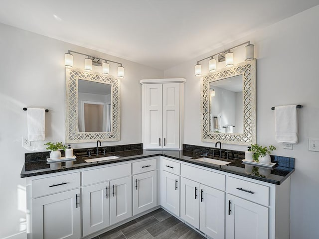 full bath with a closet and vanity