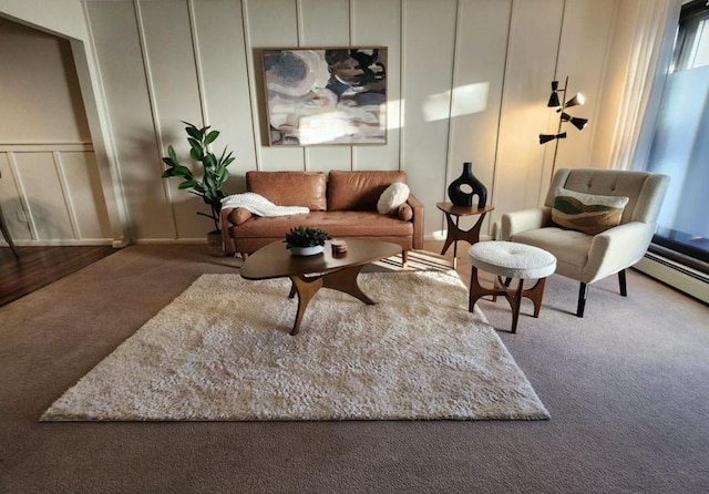 living room featuring carpet floors and a decorative wall