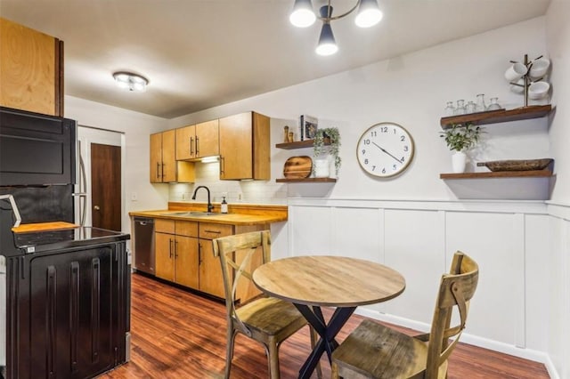 kitchen featuring dark wood-type flooring, a sink, light countertops, dishwasher, and open shelves