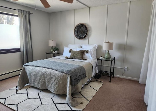 bedroom featuring a ceiling fan, light colored carpet, and baseboard heating