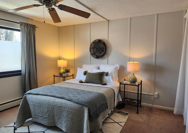 bedroom featuring a ceiling fan, light colored carpet, a textured ceiling, and baseboard heating