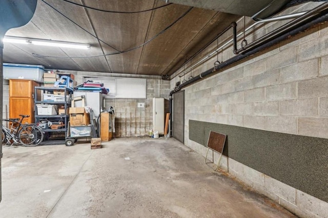 garage with concrete block wall