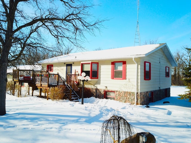 view of front of property with a wooden deck