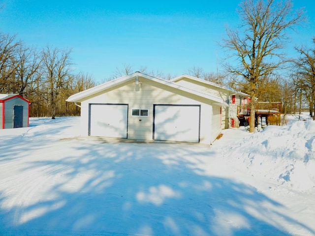 view of snow covered garage