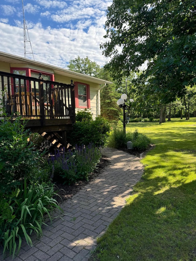 exterior space with a deck and a yard