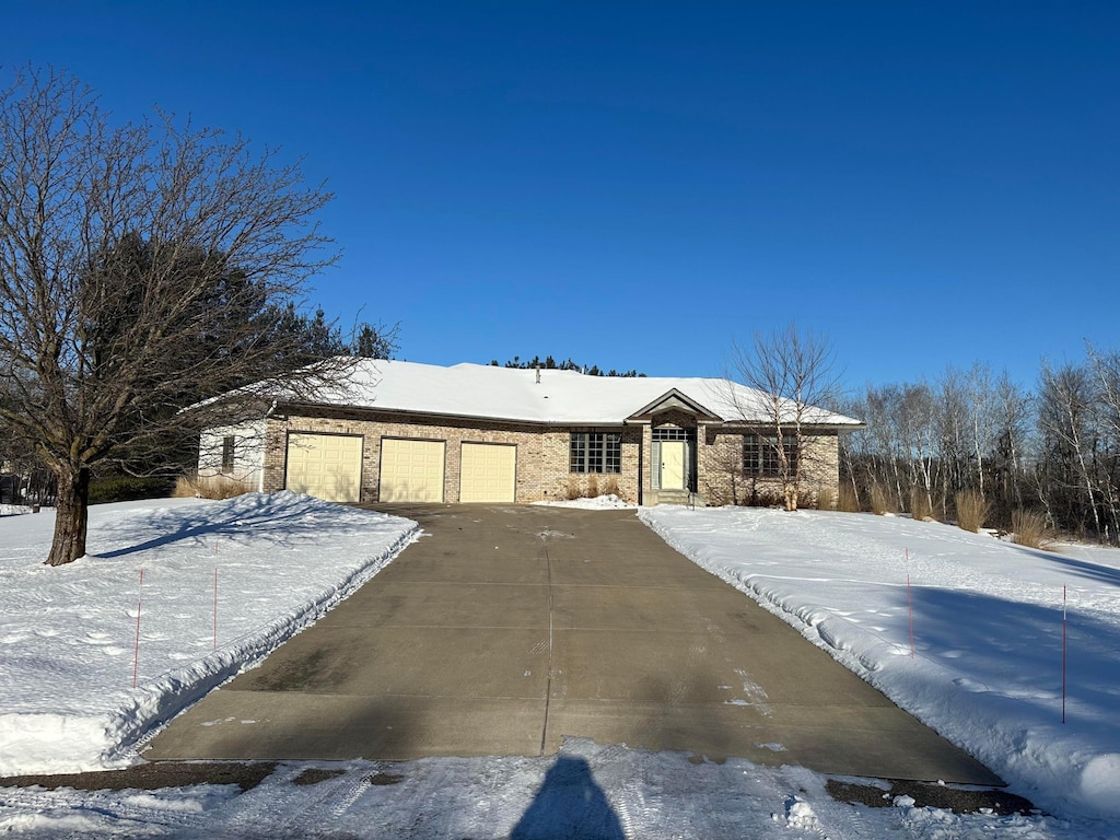 ranch-style home featuring a garage