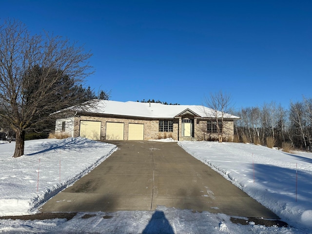 ranch-style home featuring a garage