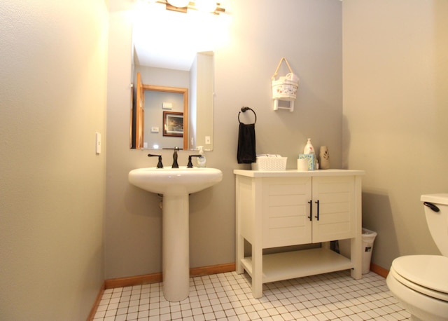 bathroom featuring tile patterned flooring and toilet