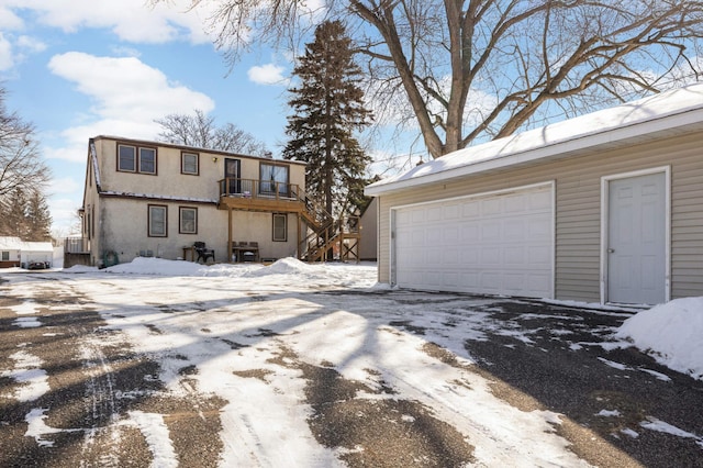 view of front of property with a garage and a balcony