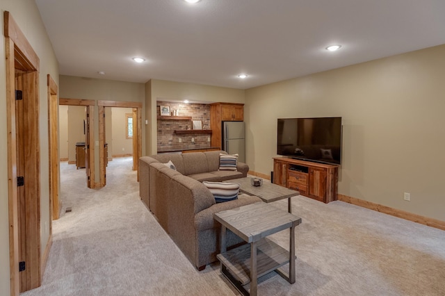 living room featuring baseboards, recessed lighting, and light colored carpet