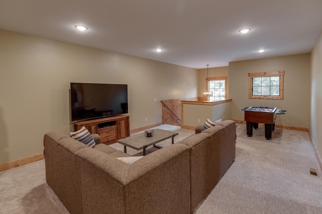 living room with light carpet and baseboards