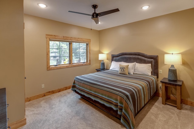 bedroom with light carpet, ceiling fan, baseboards, and recessed lighting