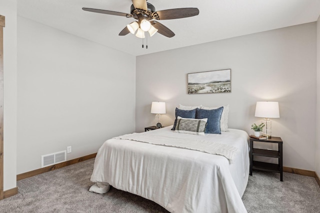 bedroom featuring ceiling fan and carpet