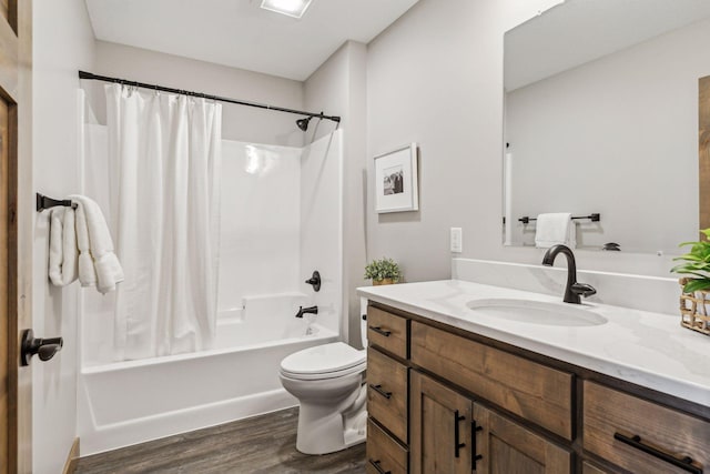 full bathroom featuring wood-type flooring, vanity, toilet, and shower / tub combo