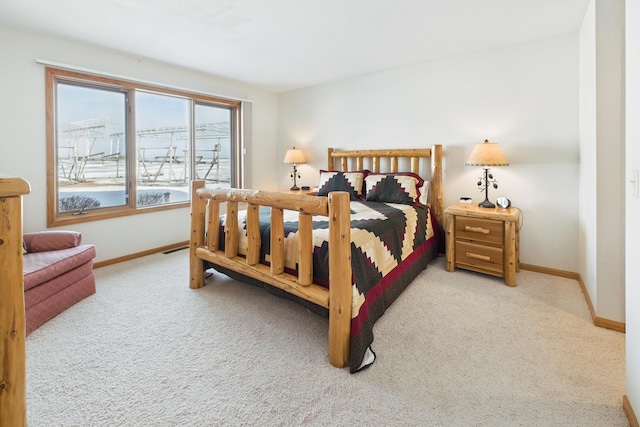 bedroom featuring carpet floors, visible vents, and baseboards