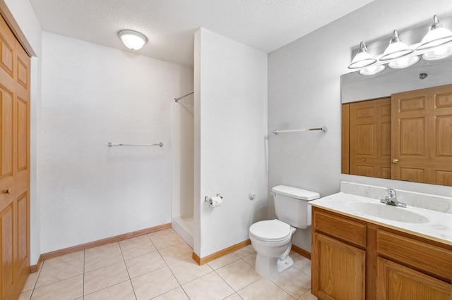 bathroom featuring vanity, tile patterned flooring, a shower with shower curtain, and toilet