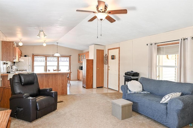 living room featuring lofted ceiling and ceiling fan