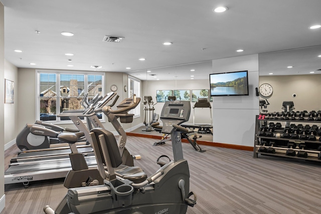 gym featuring baseboards, visible vents, and recessed lighting