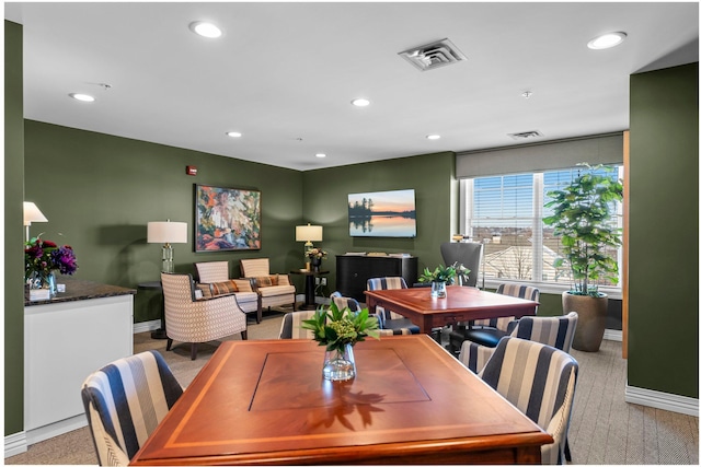 dining room featuring baseboards, visible vents, and recessed lighting