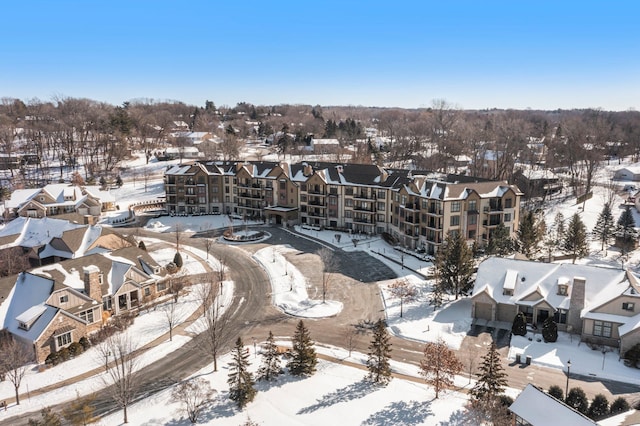 snowy aerial view featuring a residential view