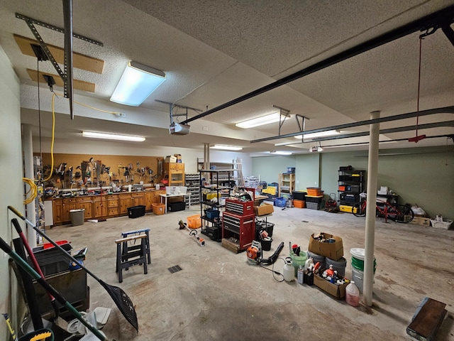 garage featuring a workshop area and a garage door opener