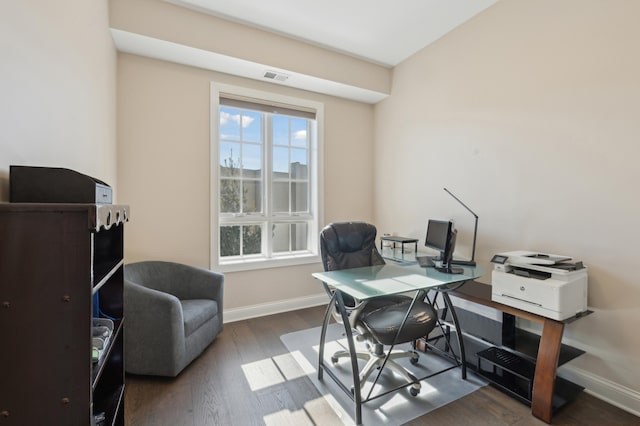 office featuring wood finished floors, visible vents, and baseboards