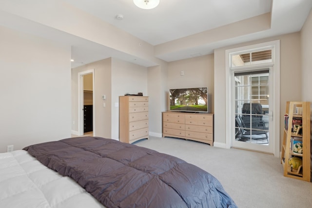 bedroom with access to exterior, baseboards, and carpet flooring