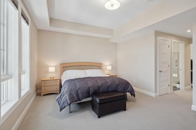 bedroom with carpet flooring and baseboards