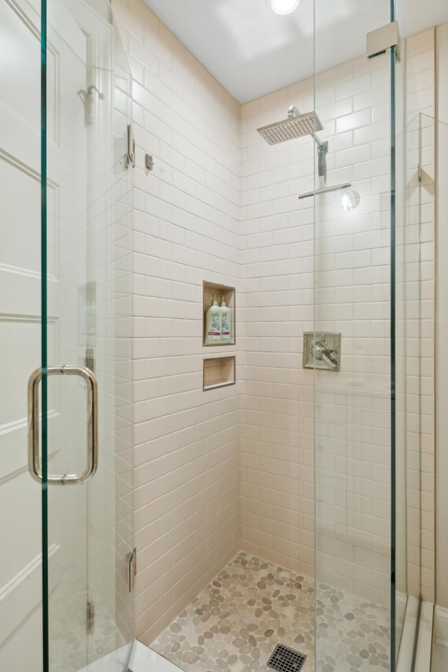 full bathroom featuring a shower stall