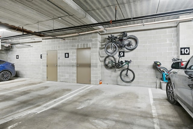 parking deck with concrete block wall and a garage door opener