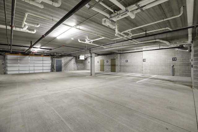 parking deck featuring concrete block wall