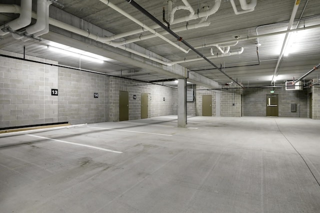 parking garage featuring concrete block wall