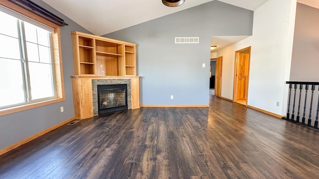 unfurnished living room with dark wood-type flooring and high vaulted ceiling