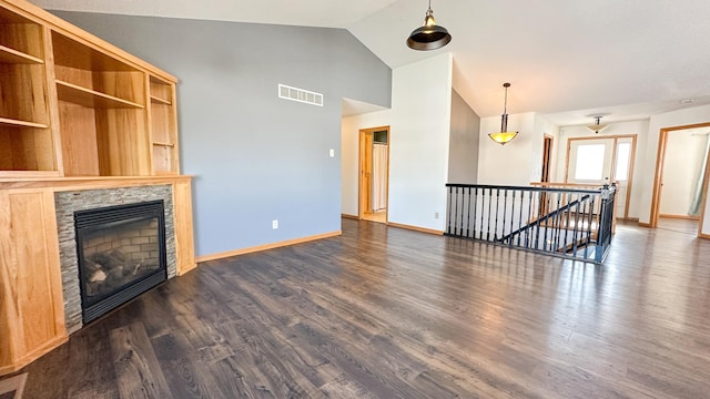 unfurnished living room with dark hardwood / wood-style flooring and high vaulted ceiling