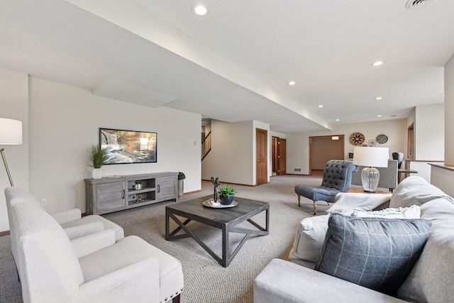 carpeted living room featuring baseboards, recessed lighting, and stairway