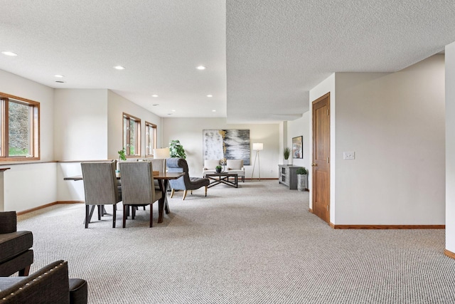 dining space with light colored carpet, recessed lighting, and baseboards