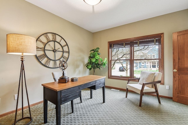 carpeted office featuring baseboards and visible vents